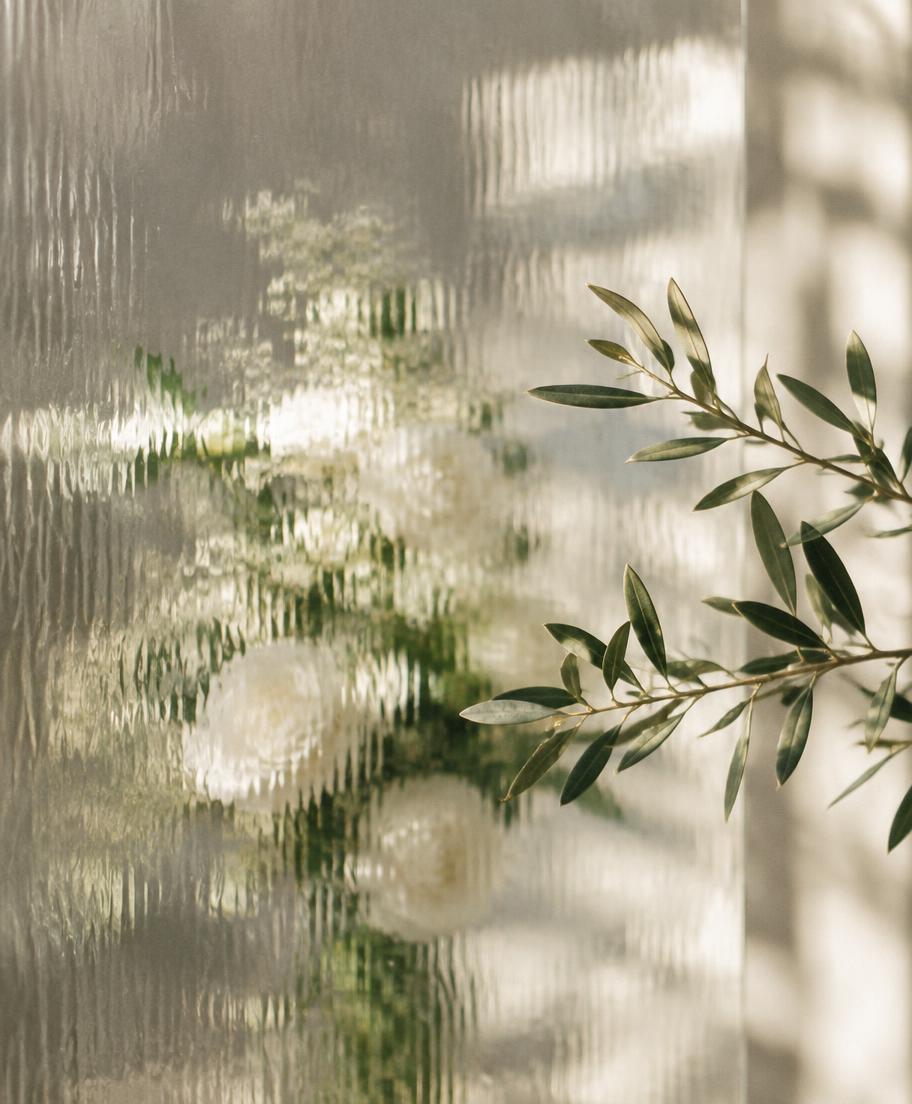 Soft daylight through textured glass in a creative studio